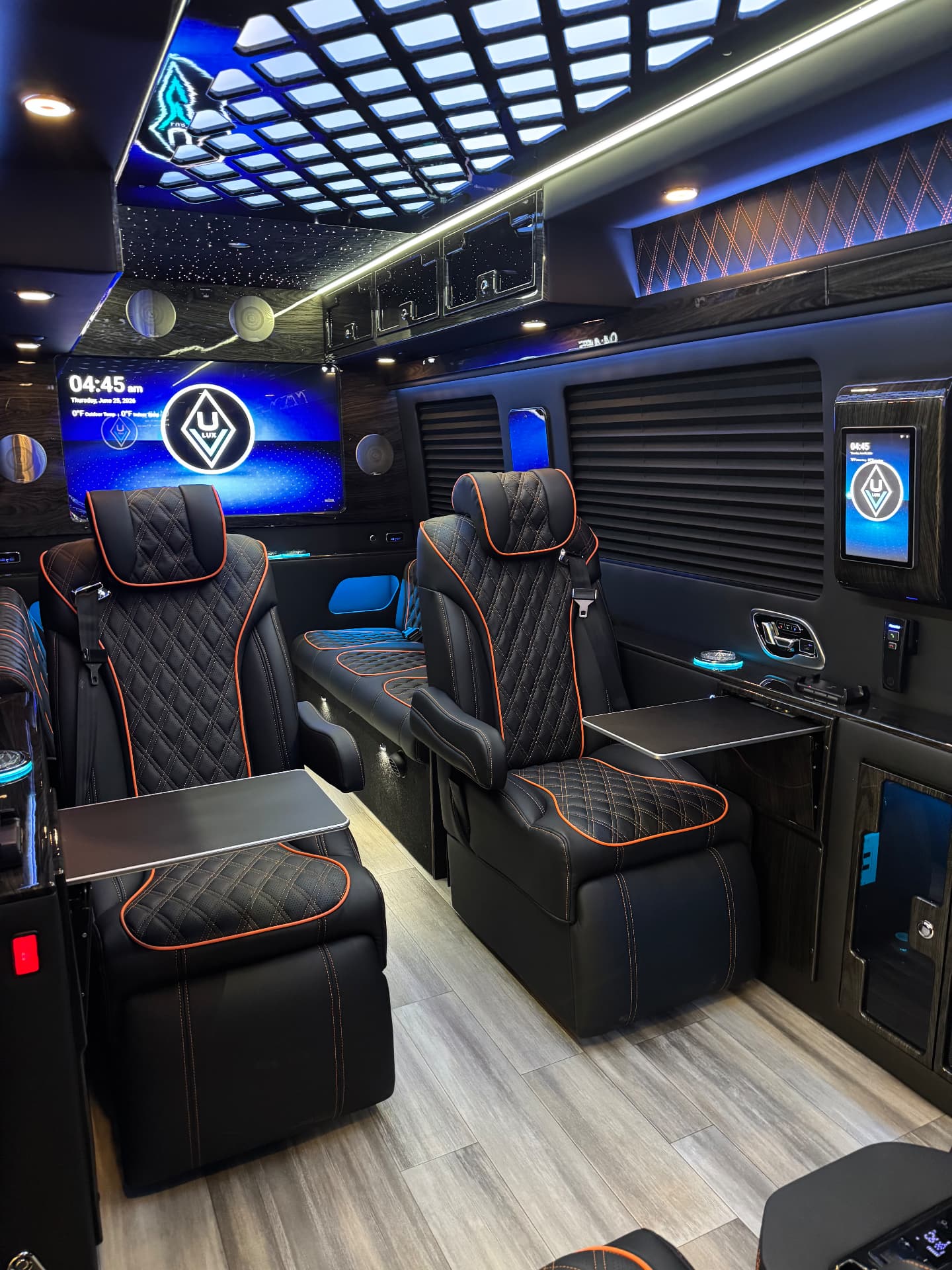 Private cabin with diamond-stitched leather seating and ambient lighting