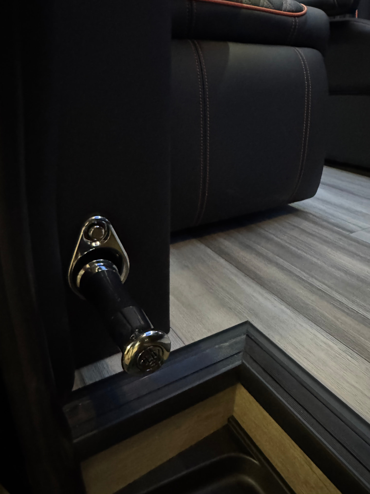 Chrome hardware and leather-trimmed cabinet detail